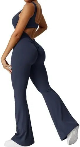 Woman wearing a sleeveless flare-leg jumpsuit for yoga in Army Green, showcasing the fashionable waist and full length.