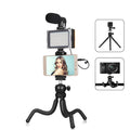 Black Octopus Yripod flexible desk tripod with fill light microphone wrapped around a chair back