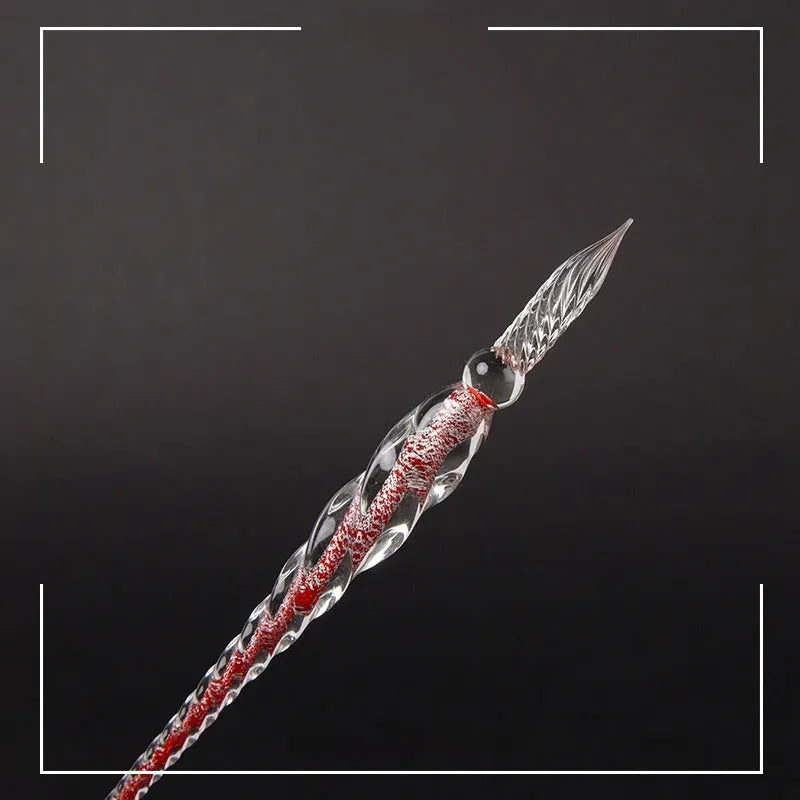 Transparent glass art pen with coloured ink dipped design in a gift box.