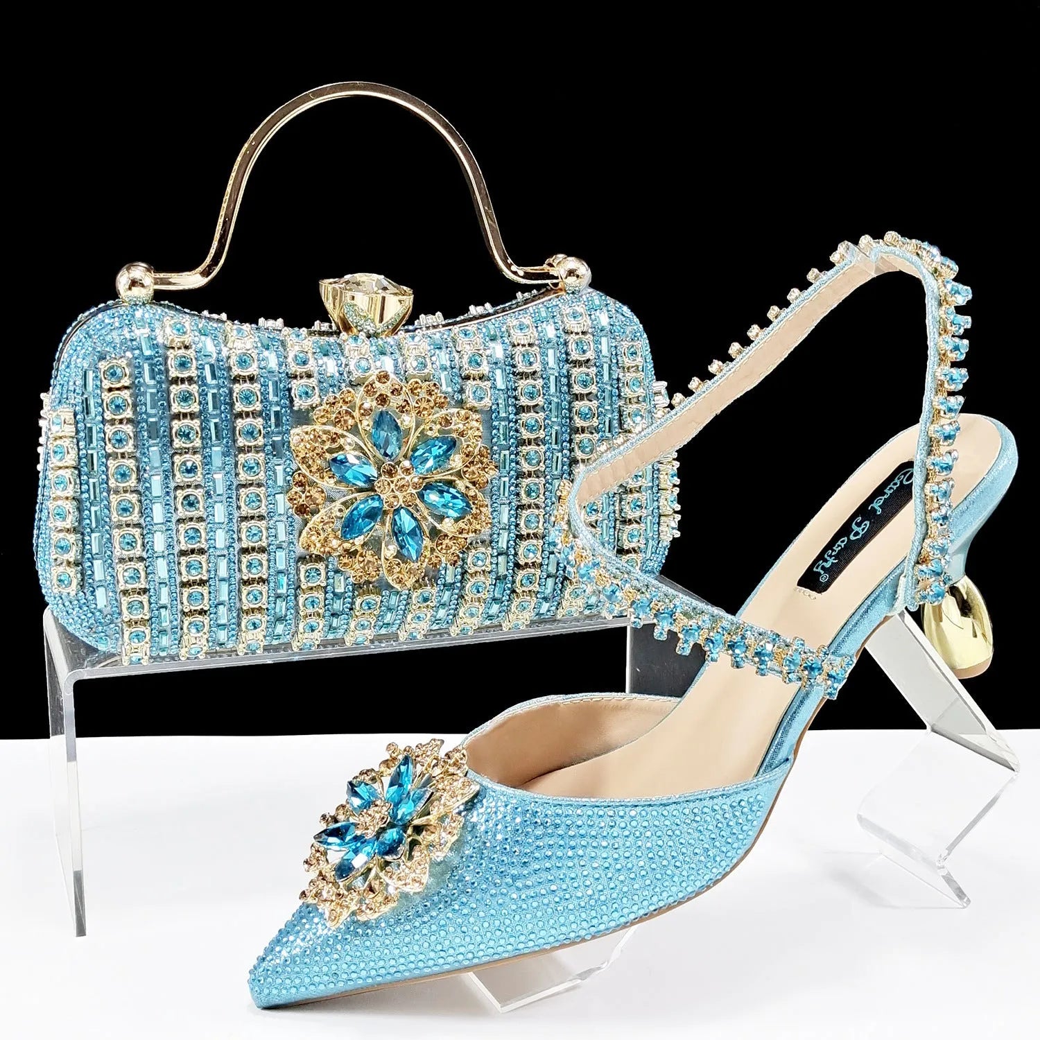 Women's black high heel shoes with matching clutch bag, decorative drill buckle flower ankle chain, and rhinestone details.