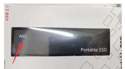 Red ultra-thin metal external SSD hard drive with high storage capacity on a desk.