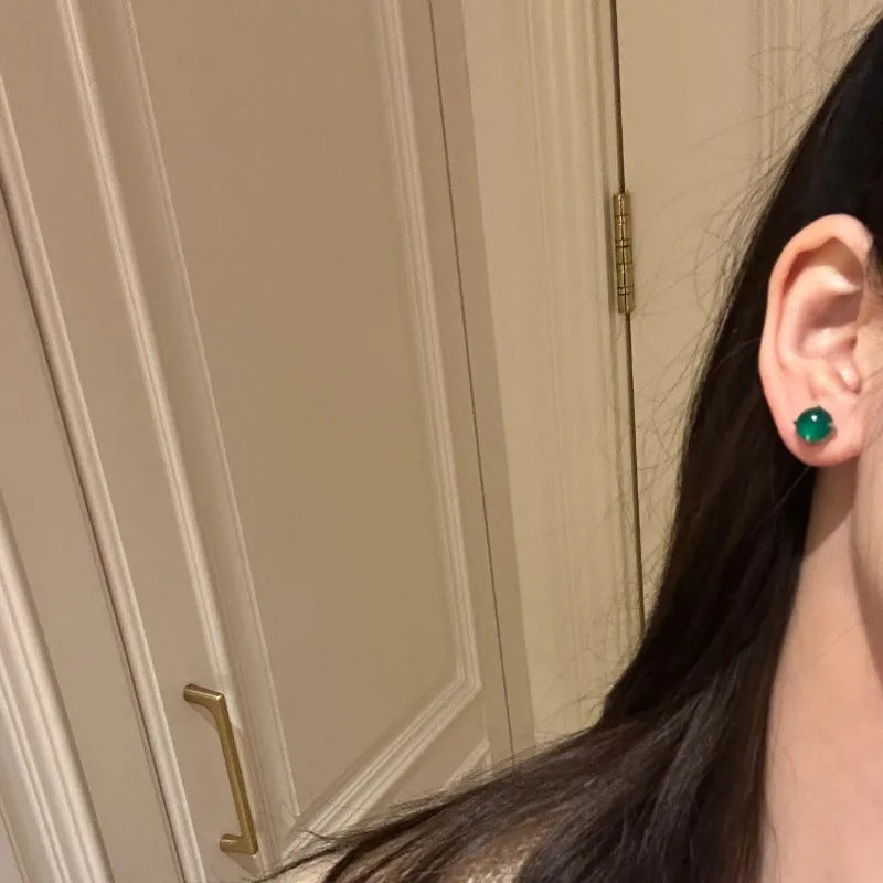 Chinese style chalcedony stud earrings with round egg surface stones in copper four-claw settings