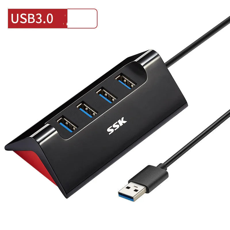 Black USB expansion hub with four ports showing USB 3.0 and USB 2.0 interfaces on ABS plastic casing