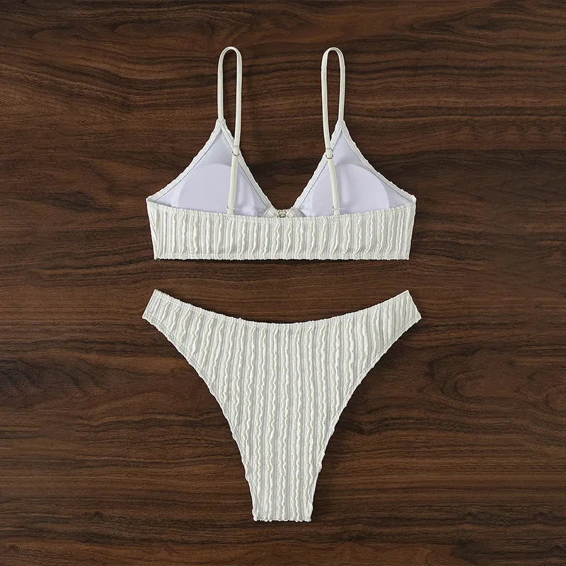 White women's V-neck swimsuit set with matching shorts for beach swimming