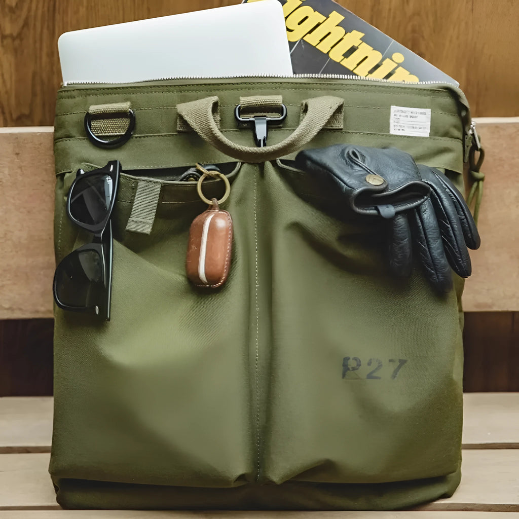 Marden Tooling military green canvas messenger bag with crossbody strap on a table