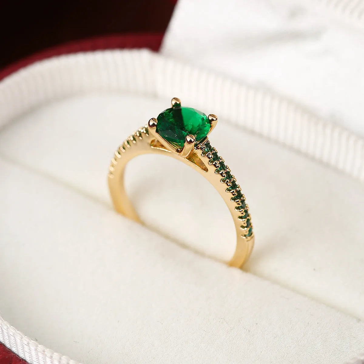 Geometric hexagon copper ring with colourful zircon stones in a metallic electroplated finish.