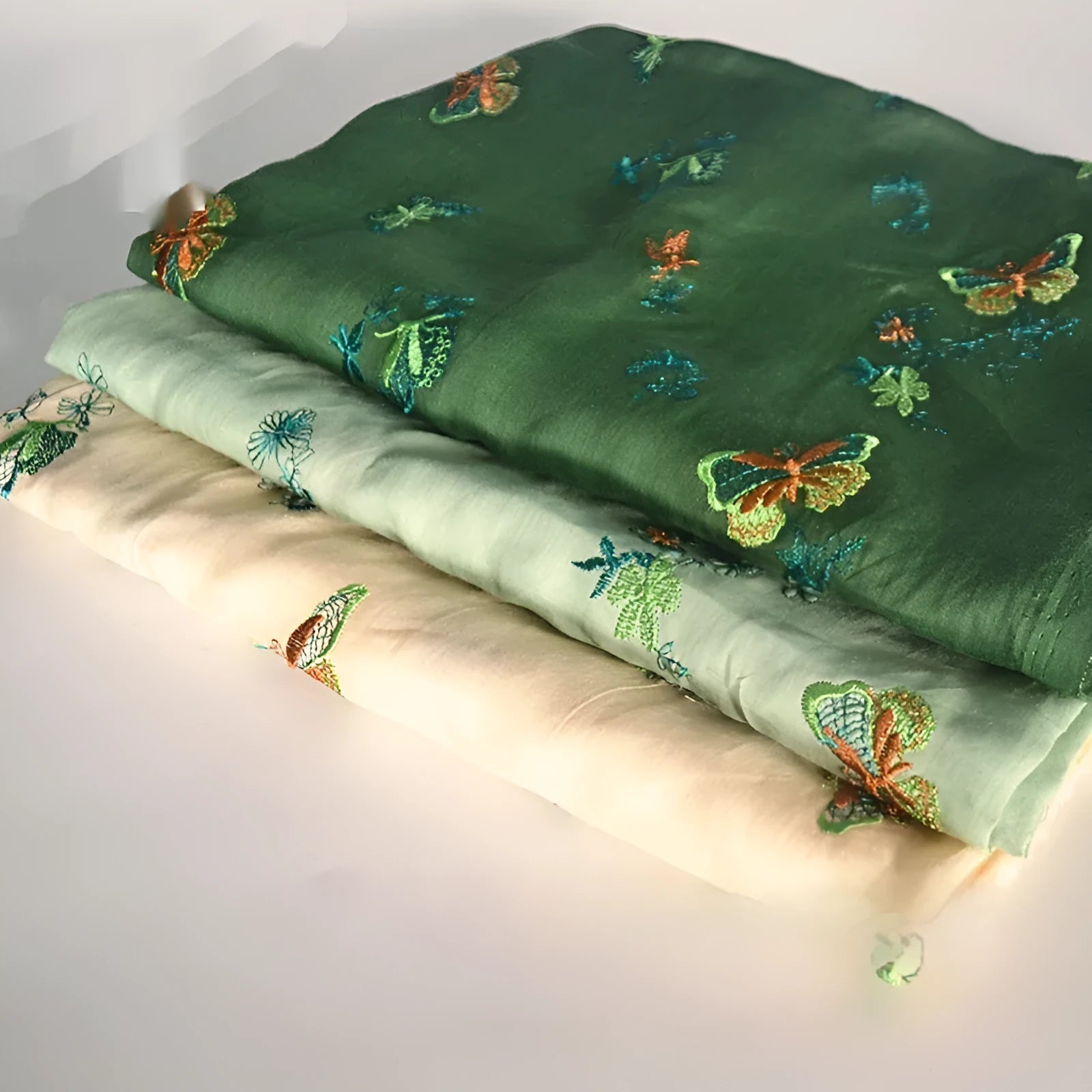 100% ramie embroidery fabric showing texture in beige, dark green and grass green colours