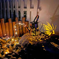 Butterfly pattern solar garden lamp with tapered iron construction and warm white LED lighting