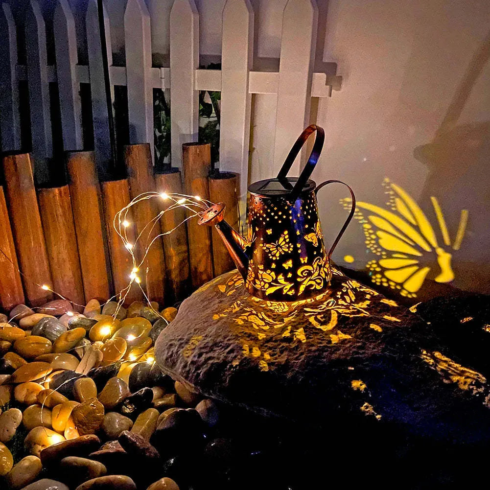 Butterfly pattern solar garden lamp with tapered iron construction and warm white LED lighting