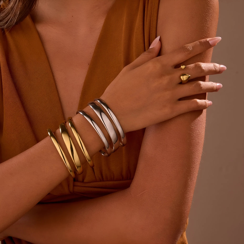 Stainless steel women's bracelet with simple opening clasp and geometric line design in gold electroplated finish