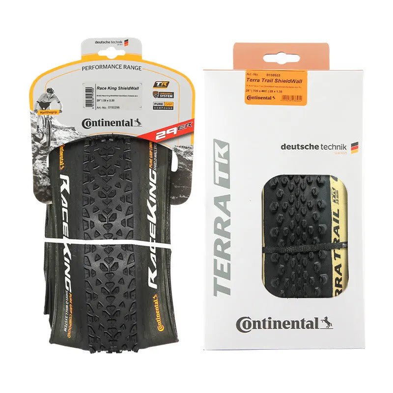 Mountain bike tyre showing tread pattern, available in yellow and white colours for 26, 27.5, and 29-inch wheel sizes