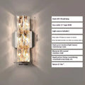 Modern crystal and stainless steel wall lamp in chrome finish with LED lighting.