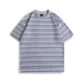 Loose fit round neck cotton t-shirt in apricot colour with half sleeves on a hanger.