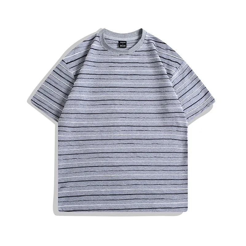Loose fit round neck cotton t-shirt in apricot colour with half sleeves on a hanger.