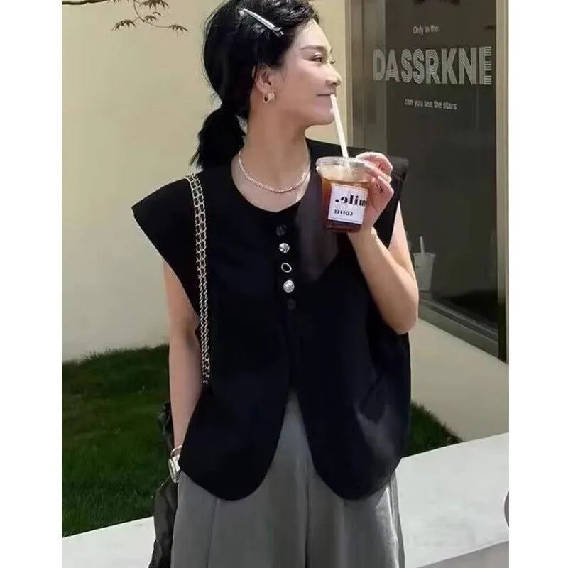 Women's loose fit polyester vest with pocket in milky white or black, 40cm short length