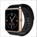 Black smart watch with 1.54 inch touchscreen and silicone strap on a wrist.