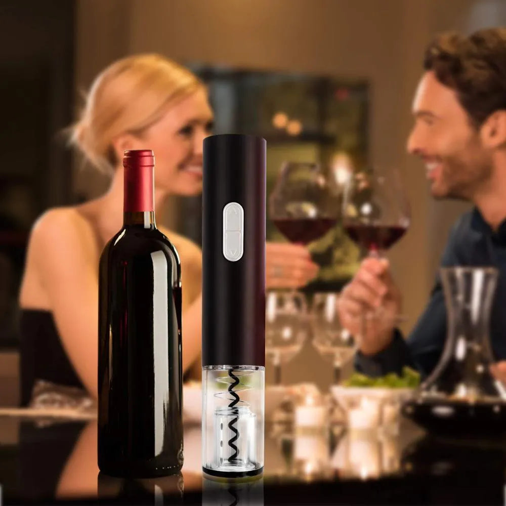 Black automatic electric wine bottle opener with foil cutter on a wooden table