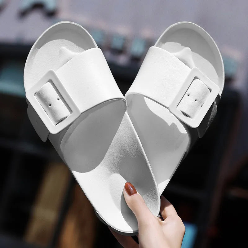 Women's grey blue buckle fastening flip-flop sandals with soft EVA sole on a white background.