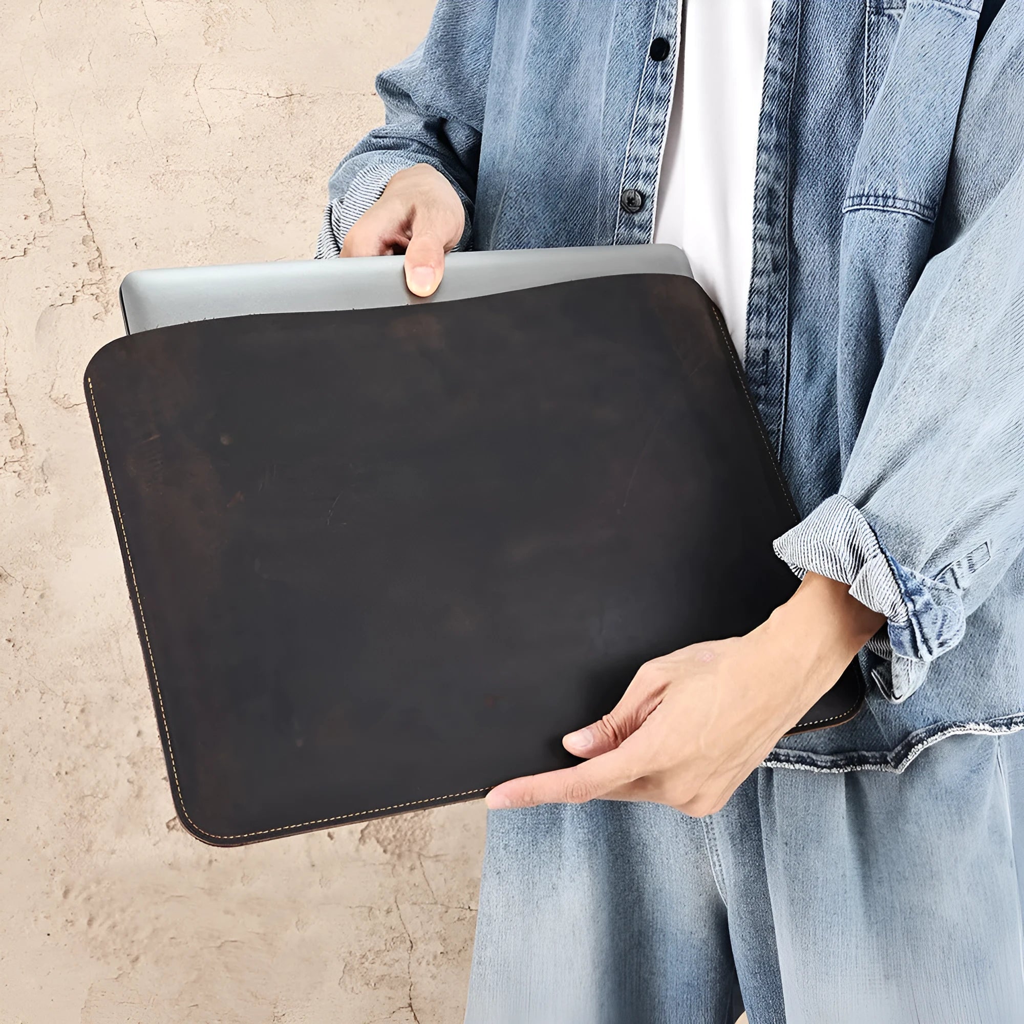 Brown Crazy Horse leather horizontal computer liner bag with a laptop inside
