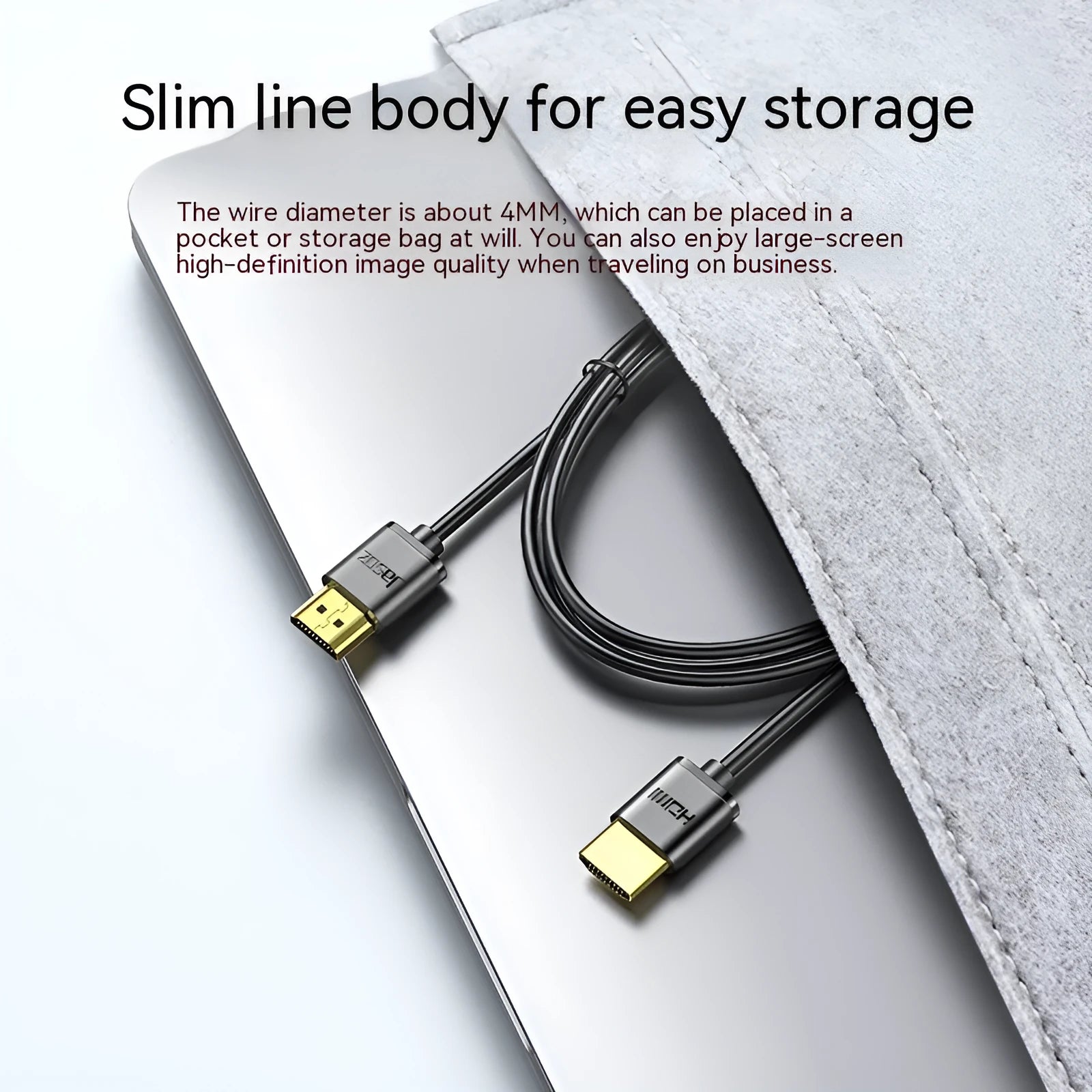 Thin flexible HDMI video cable with gold-plated connectors on a white background.
