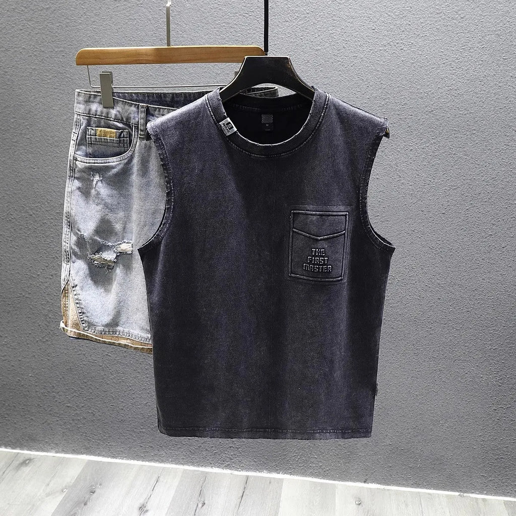 Women's loose-fit black cotton sleeveless t-shirt with straight hem on a hanger.