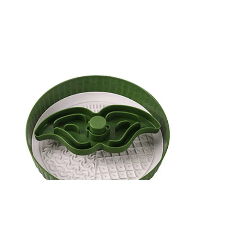 Grey plastic pet bowl with rotating windmill-pattern slow feeder licking mat inside