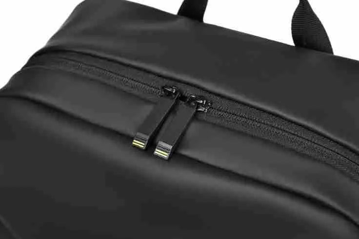 Large black waterproof PU leather backpack for men with sewing thread detailing and computer bag