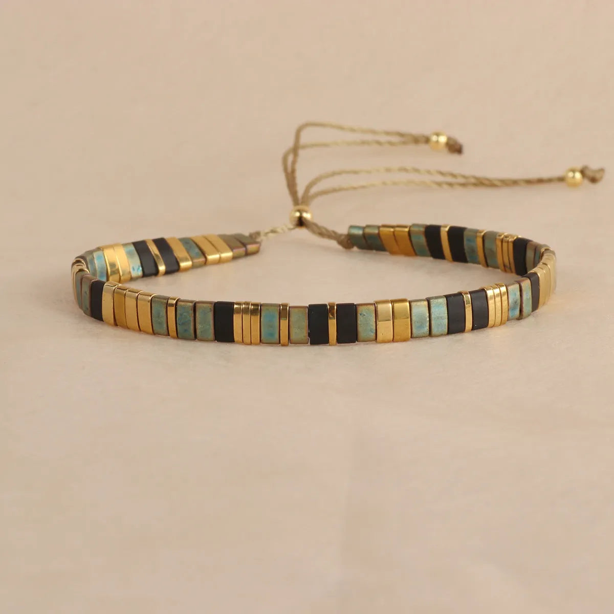 Glass and coloured glaze beaded bracelet with geometric round beads in five colour options