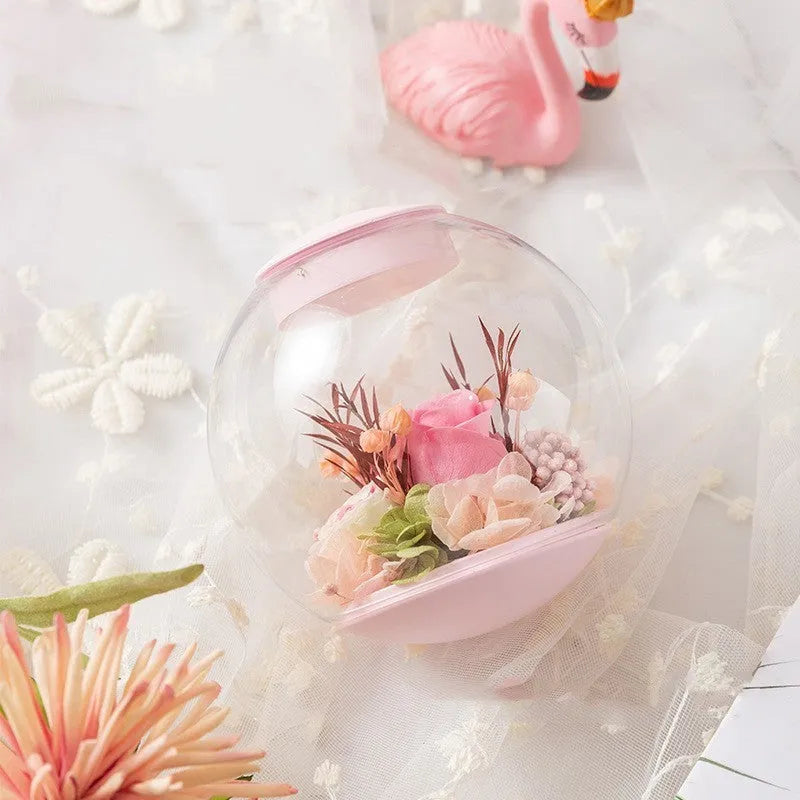 Pink preserved rose decorative ornament with optional base and Bluetooth speaker functionality.