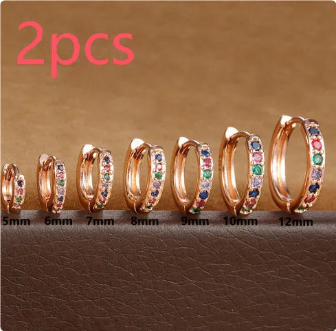 Circle zircon perforated stud earrings in gold, rose gold, and silver colours showing geometric round design with multiple size options