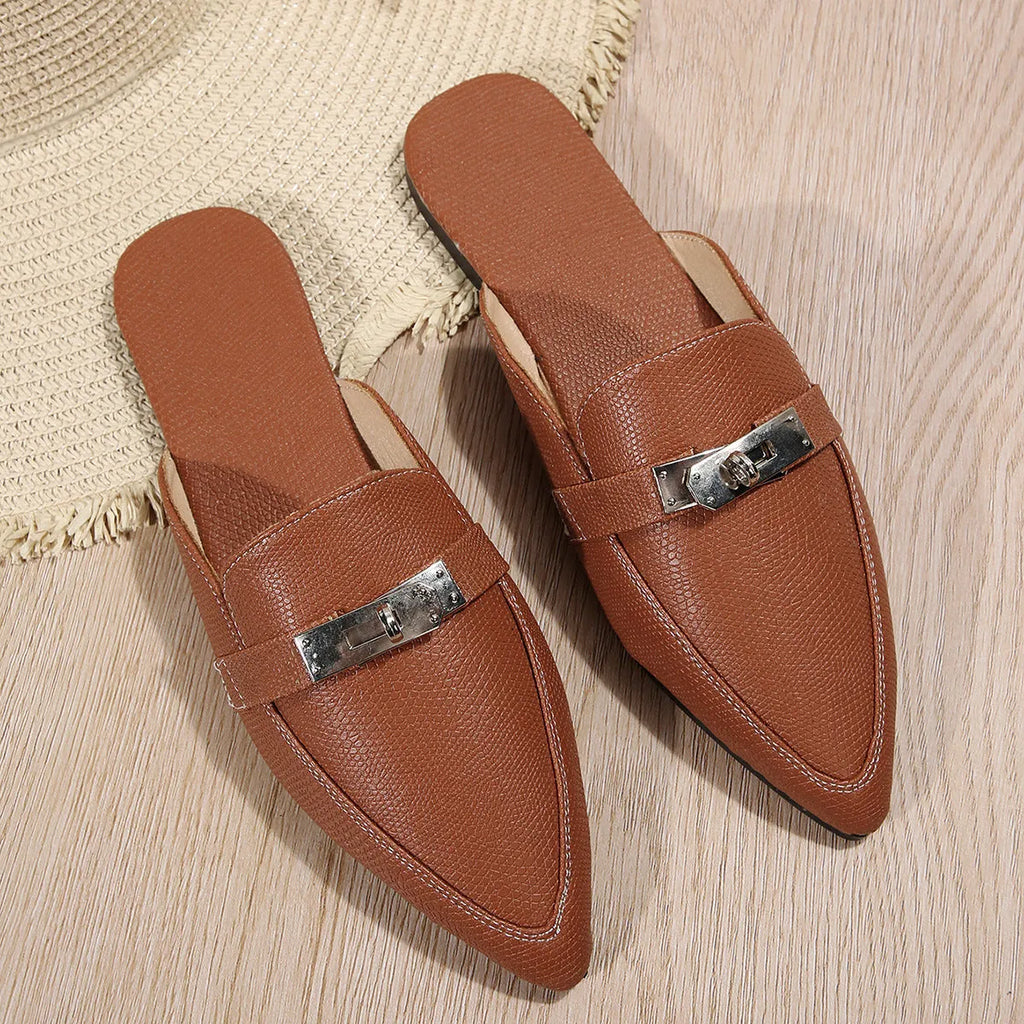 Light brown women's pointed-toe casual slippers with a low heel and rubber sole.
