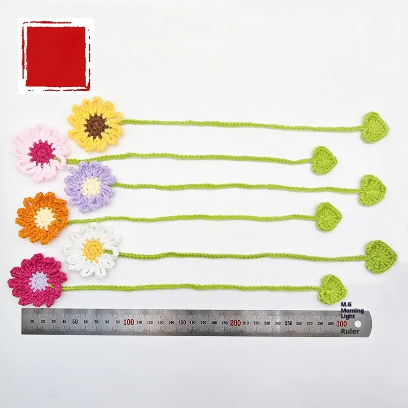 Hand-crocheted wool bookmark with daisy motifs on flexible wire in multiple colour options