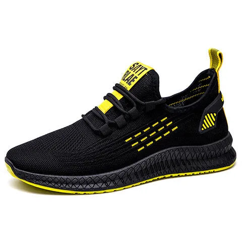 Men's low-top black casual sports shoes with cross strap detail and Flying Weave upper on a wear-resistant sole.