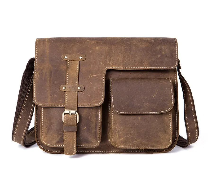 A leather vintage messenger crossbody bag shown in dark coffee colour with a flap closure and adjustable strap.