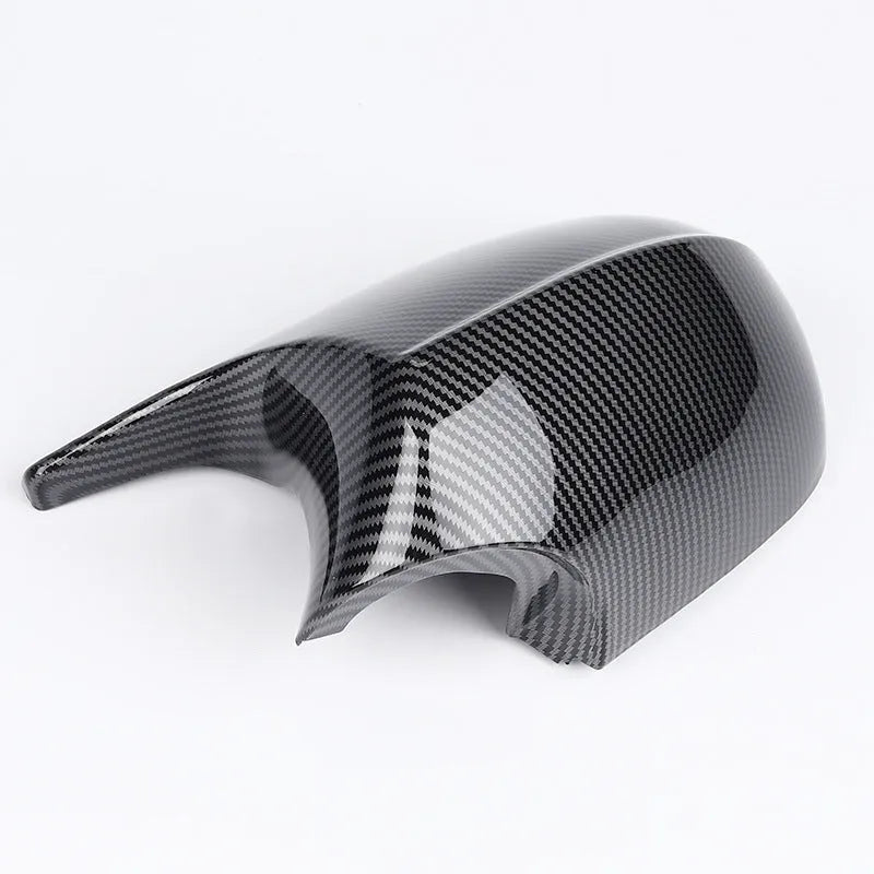 Pair of black ABS plastic rearview mirror shells for BMW 3 Series E90, shown alongside original equipment part numbers.