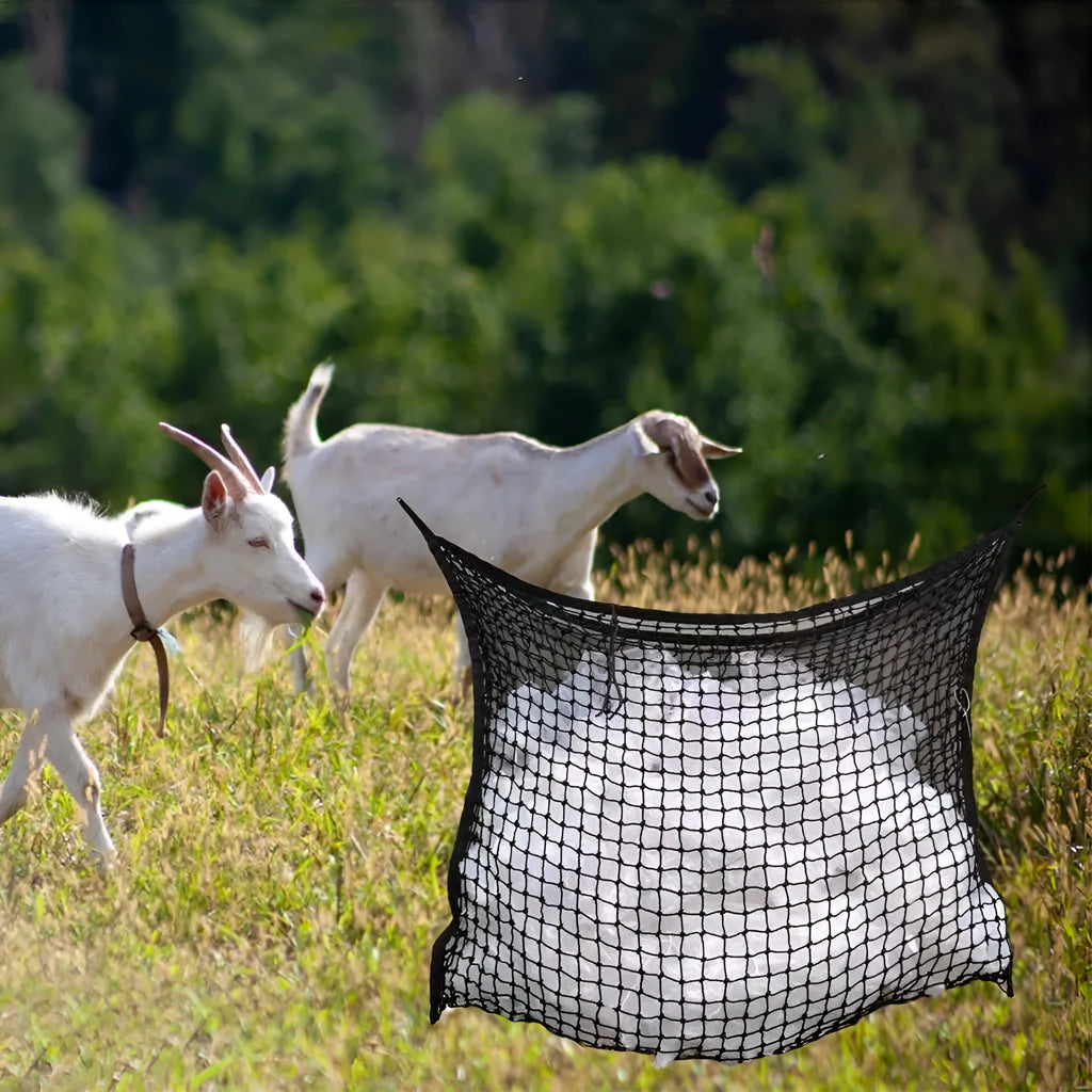 Woven grid horse feeding bag in black or white colours with hanging straps for livestock feeding