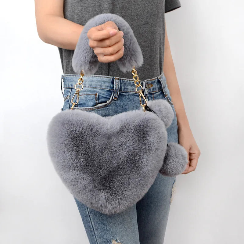 Heart-shaped women's plush handbag with soft texture and detachable shoulder strap in medium size