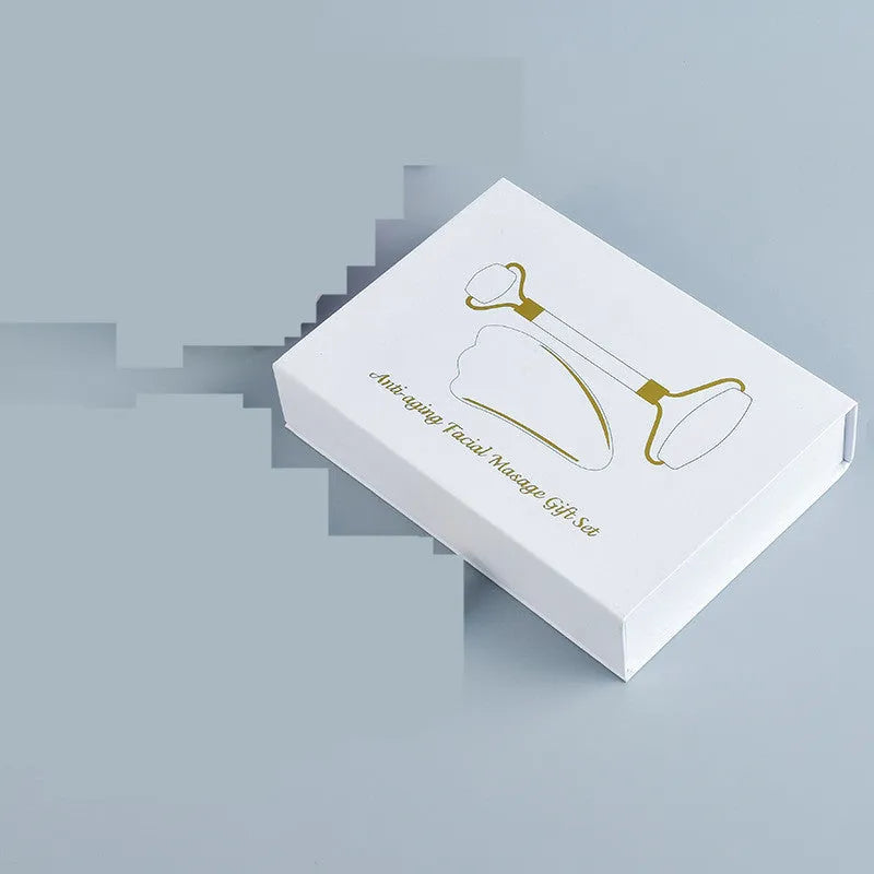 White jade facial roller and gua sha board set for skincare massage