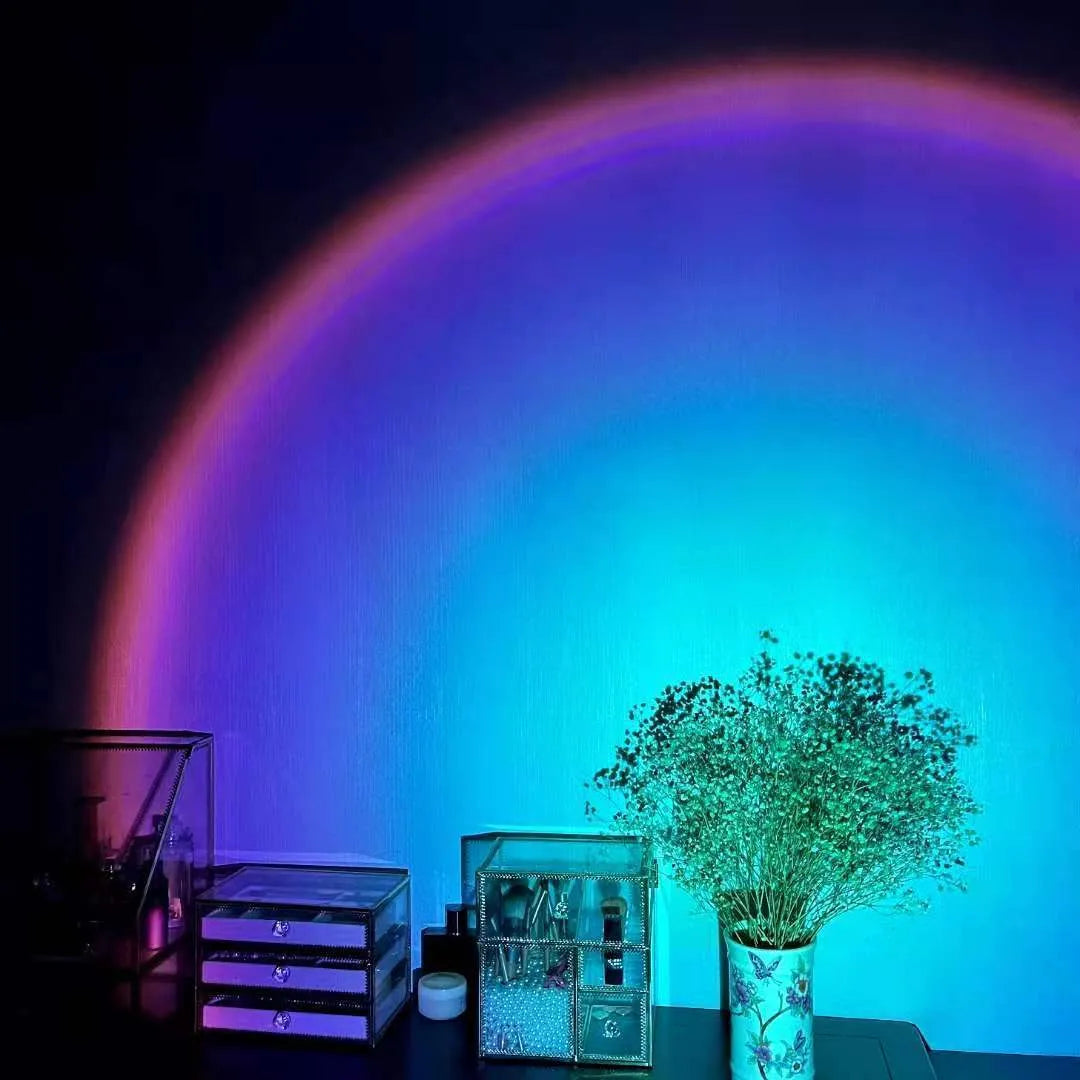Rechargeable sunset red projection lamp with USB power connection and rainbow lighting effects