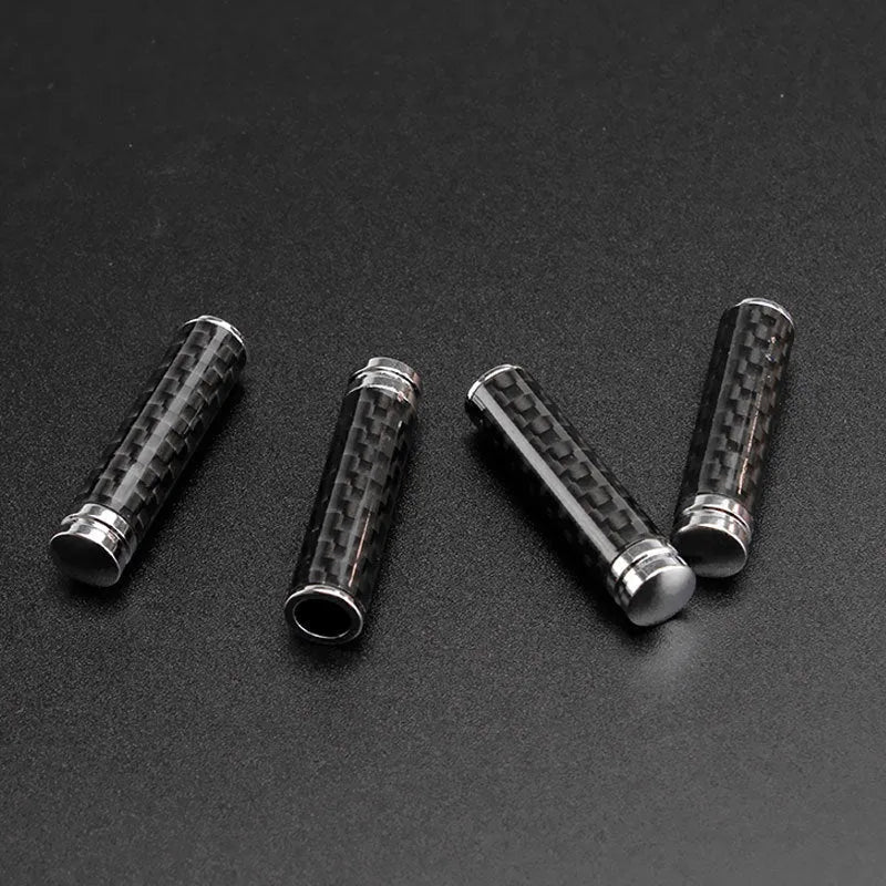 Four carbon fibre and metal car door handle decorative covers for direct replacement installation.