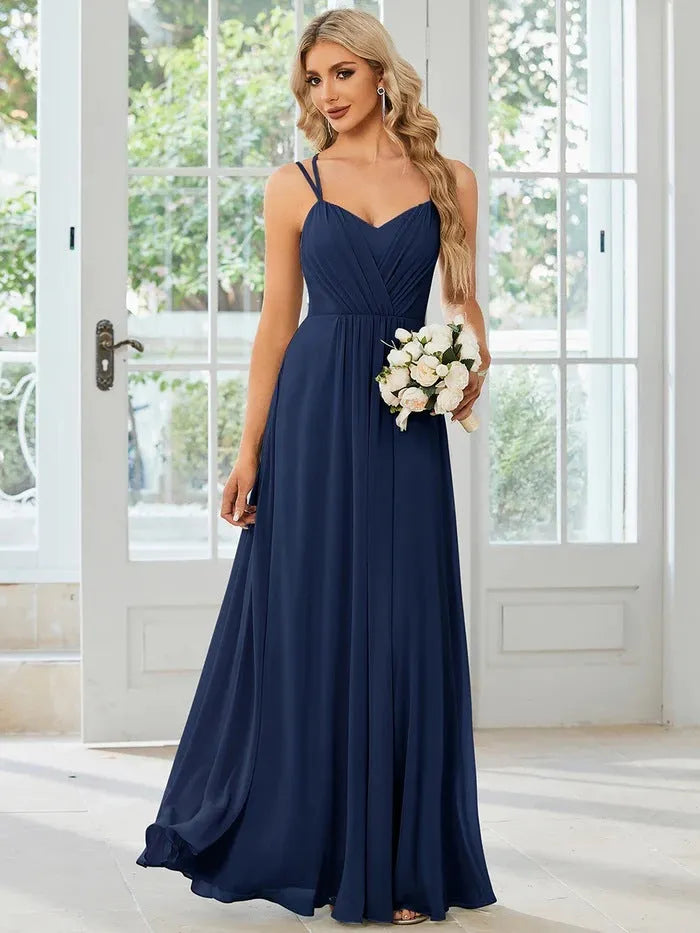 Women's light green sleeveless A-line banquet dress with long pleated skirt on a hanger.