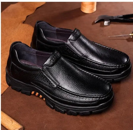 Men's black and brown leather slip-on business casual shoes with a rubber sole.