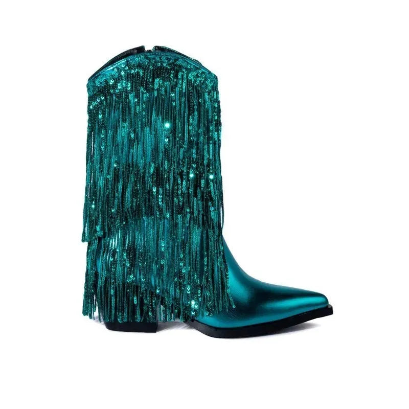 Women's black chunky heel tassel boots with a pointed toe and a high stiletto heel on a fashion runway.