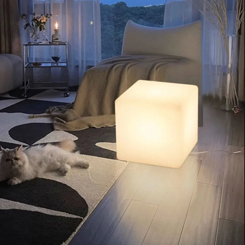 Modern white LED square cube light for outdoor garden and pathway illumination.
