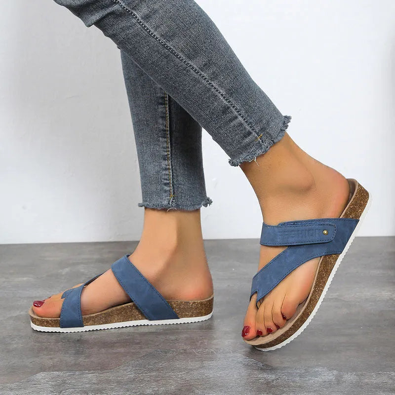 Women's flat toe ring flip-flop in a solid colour with a thick foam sole.