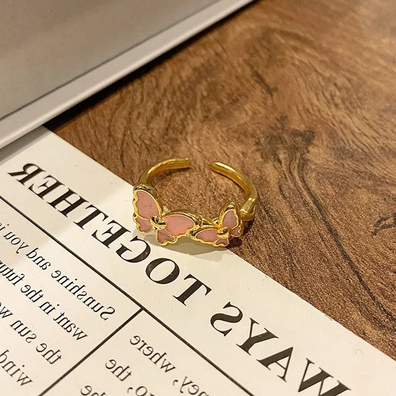 Copper Chinese butterfly women's ring showing creative design with oil dripping treatment finish