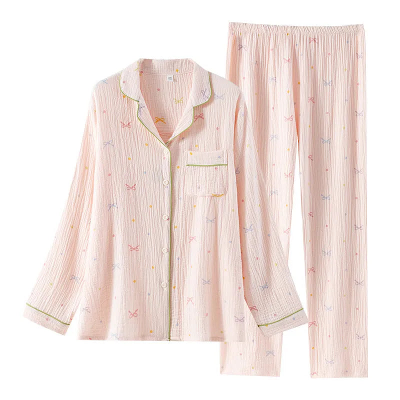 Beige and pink women's long-sleeved cotton pajama set with trousers on a hanger.