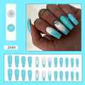 Long solid colour ballet artificial nails with blue diamond glitter glue on a pink background