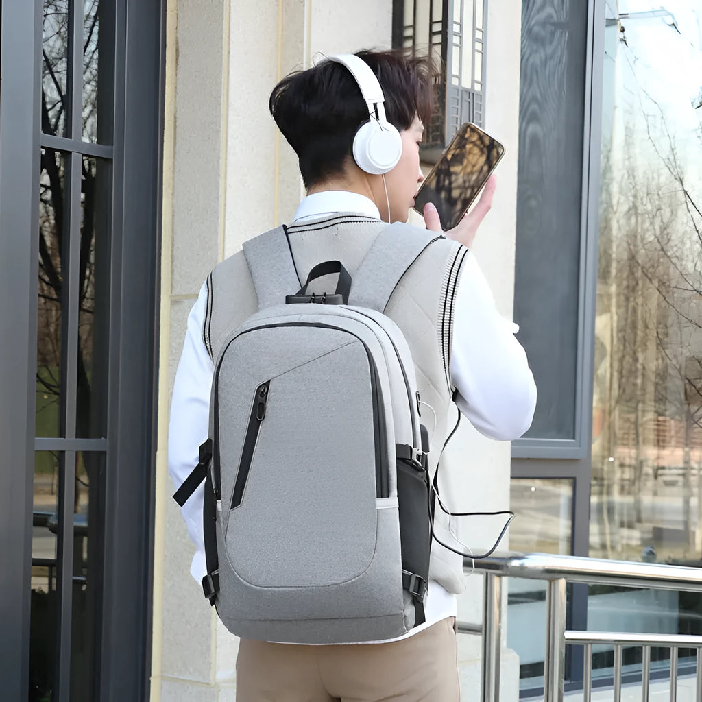 Grey Oxford cloth computer backpack with street trend style, shown with laptop compartment and front pocket.