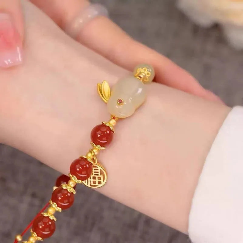 Handmade Chinese style glass bracelet with bamboo joint beads in a red Lvzhu Duobao design.